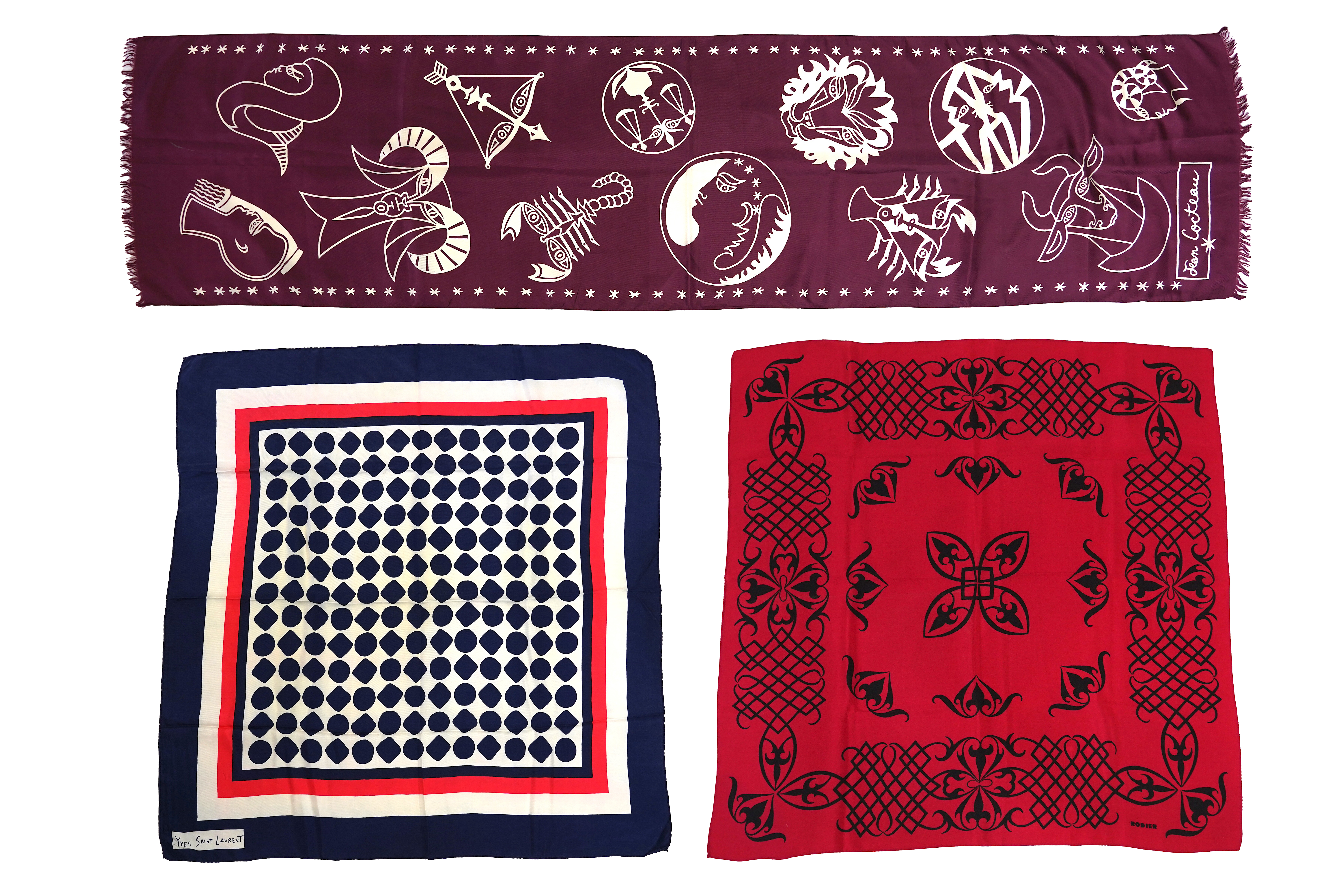 A Yves Saint Laurent silk scarf, a Jean Cocteau zodiac design silk scarf and a Rodier silk scarf.